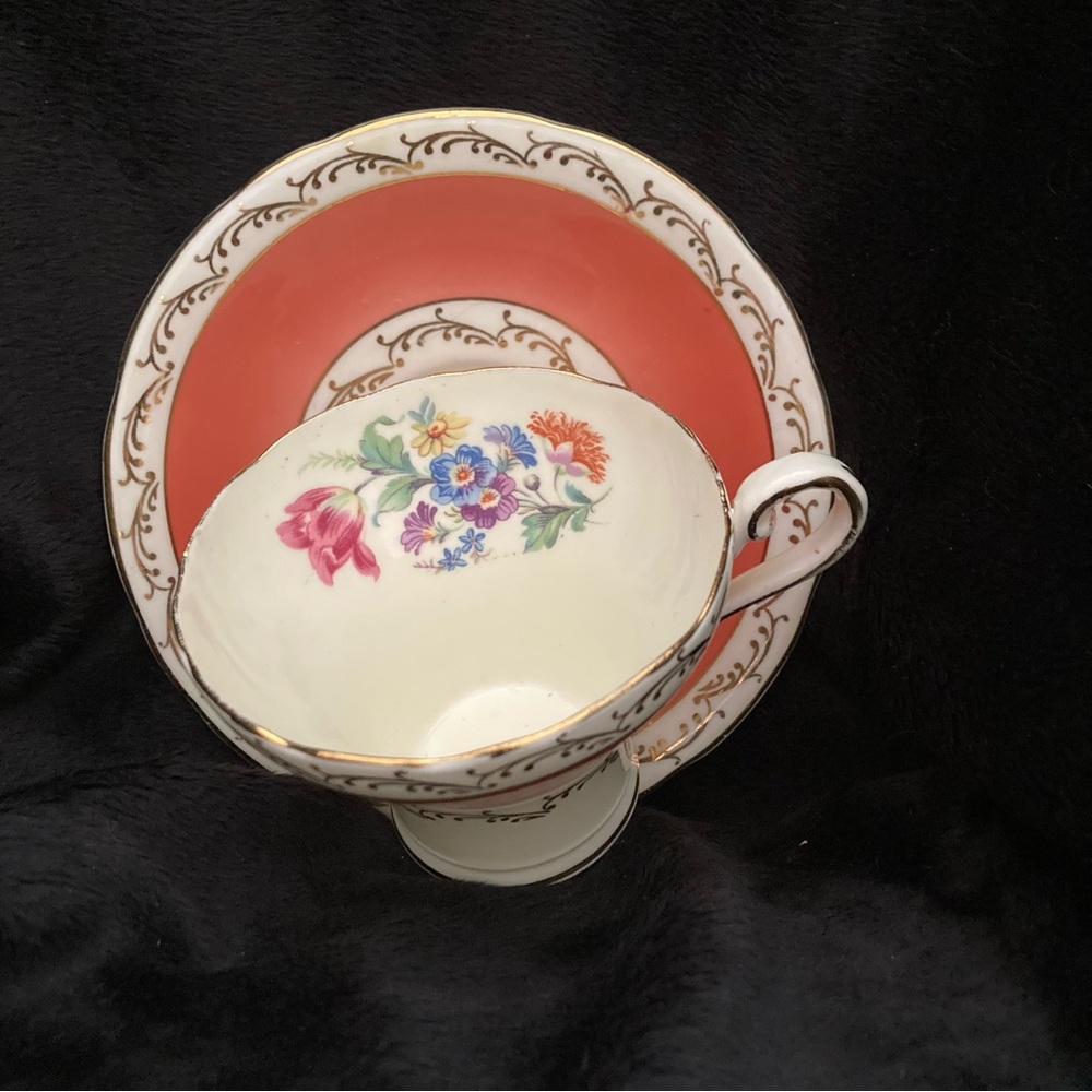 Aynsley bone china teacup and saucer with floral and gold trim.